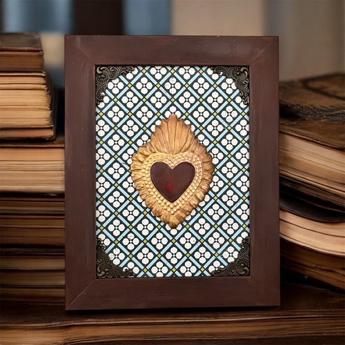 Cornice con cuore sacro